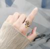 Explosiones europeas y americanas abren anillo de girasol giratorio personalidad femenina creativo anti-presión anillo de margarita anillo al por mayor