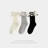 Calcetines para niñas primavera y otoño calcetines de media pantorrilla calcetines de princesa con lazo para niños calcetines de encaje retro coreano calcetines holgados para bebé