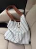 Bolso de Lona Rayado de Gran Capacidad Estilo Coreano 2026 Nuevo Casual Versátil Bolso de Hombro/Axila Bolso Cubo de Transporte