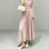 Falda Media de Moda Femenina de Alta Calidad Estilo Miyake 2026 Nueva Cintura Elástica Suelta Acampanada Falda Casual Versátil Línea A Larga