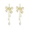 Aretes de borla con moño de diamantes completos, diseño de nicho, alta gama, elegantes, a la moda, aretes versátiles, venta al por mayor