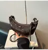 Bolsa de ombro feminina transfronteiriça de nicho coreana estilo croissant 2026 nova versátil casual super popular bolsa bolinho elegante de ombro ou transversal
