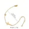 Pulsera de acero inoxidable con cruz más vendida transfronteriza, nicho de lujo ligero, acero de titanio de alta gama chapado en oro de 18k y pulsera de circón