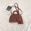 Bolsa Transfronteiriça Feminina Moda Primavera 2026 Bolsa Concha ins Versátil Cor Sólida Bolsa de Mão para o Trabalho Bolsa de Ombro Único Transversal