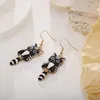 Brincos de Gato Desenho Animado Esmalte Preto Gato Flor Gatinho Fofo Pingentes de Orelha Brincos da Moda para Mulheres Brincos Pretos Transfronteiriços