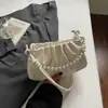 Bolso de Axila Plegado de Nicho Estilo Coreano para Mujer Moda Otoño 2025 Estilo Cadena de Perlas Bolso de Hombro Cruzado para Viajar