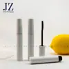 Jinze encomenda tubos plásticos redondos vazios com aplicadores de silicone para cílios, materiais de embalagem