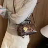 Bolso tipo almohada retro de axila de mano para mujer, nuevo modelo 2026, versátil bolso casual de gamuza para hombro y cruzado
