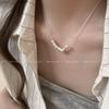 Colar de pérolas com pingente de coração estilo leve feminino com design de nicho e corrente de clavícula 2024 novo estilo elegante colar