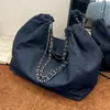 Bolso de mezclilla para mujer, gran capacidad, nuevo modelo 2026, bolso de hombro versátil con cadena para cruzar el cuerpo, bolso de tela con un toque de alta gama, bolso tote