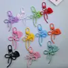 Llavero colgante con forma de lazo creativo y colorido hueco con etiqueta de corazón en inglés, accesorio de joyería con cuentas femenino