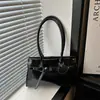 Bolso de axila grande retro y minimalista para mujer, nuevo bolso de hombro casual y elegante 2026, gran capacidad, adecuado para ir al trabajo y se puede llevar como bolso de mano.