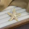 Broche de Estrela do Mar em Liga de Metal Retrô Francês Europeu e Americano Luxo Leve Simples Textura Dourada Série Oceânica Fabricante de Broches