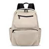 Mochila de tela de nailon ligera y duradera de color sólido con un tacto de alta gama, adecuada tanto para hombres como para mujeres, multibolsillos, mochila de gran capacidad para negocios y viajes.