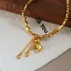 Nuevo Pulsera de Carrusel de Monedas de Cobre Huecas Exquisita de Moda Versátil Estilo Chino Retro con un Toque de Lujo de Gama Alta y Joyería de Borla