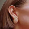 Collar rosa con diseño de cristal y patrón de hierba curva para mujer, pendientes modelo nuevo 2026, diseño de nicho de lujo ligero, anillo de alta gama