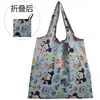 En stock moda de dibujos animados mediana bolsa de compras de supermercado bolsa de compras de protección ambiental en stock al por mayor plegable portátil con fuerte