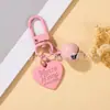 Estilo Casual y Lindo Llavero Colgante de Campana con Corazón Pintado Colorido Funda para Teléfono Móvil Bolso Auriculares Set de Accesorios Pequeños
