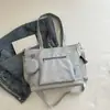 Bolso de lona de color liso transfronterizo nuevo, bolso de hombro de gran capacidad, bolso tote versátil para estudiantes, bolso de mano, bolso cruzado
