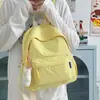 Mochila Simples Estilo Japonês para Mulheres 2026 Nova Bolsa Casual Estilo Ins de Duas Alças para Alunos do Ensino Fundamental II e Médio