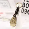 Estilo Criativo Fofo Bronze Antigo Desenho Animado Gato Gordo Decoração de Anel Pingente de Bolsa Couro Trançado Artesanal Chaveiro de Carro
