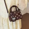 Nuevo bolso de mano cruzado de moda para mujer, exquisito, de ante, para ir al trabajo, otoño 2026, de un solo hombro, con estampado de lunares de bola de boliche