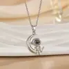 Venta Caliente Transfronteriza Creativo Astronauta Luna y Estrella Proyección 100 Idiomas Te Amo Pareja Día de San Valentín Collar Joyería