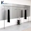 Tienda de Ropa Estilo Nuevo Exhibidor de Acero Inoxidable Plateado Colgador de Ropa Montado en Pared Lateral para Exhibición en Tiendas de Ropa para Hombre y Mujer