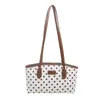 Tendencia transfronteriza bolso de cubo de mano fresco para mujer 2026 otoño nuevo lunares bloques de color bolso de un solo hombro bolso para el hombro para el trabajo