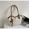Bolsa Versátil Feminina de Grande Capacidade 2026 Nova Bolsa de Ombro Casual com Textura Simples para o Dia a Dia Bolsa Tote de Axila