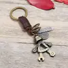 Llavero de Venta Caliente Versión Coreana, Colgante de Llave de Cuero, Robot de Aleación para Hombre, Accesorio de Moda Personalizado de Cuero, Venta al por Mayor