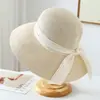Nuevo estilo de verano sombrero de paja de ala ancha simple y elegante con lazo para mujer, adecuado para vacaciones en la costa y la playa, sombrero de protección solar y sombra