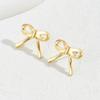 Aretes de Metal con Lazo de Diseño Nicho al por Mayor de Fábrica para Mujer, Simples, con Sentido del Diseño y Versátiles, Personalizados