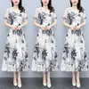 Verano 2023 nuevo vestido de mujer de mediana edad talla grande temperamento adelgazante cintura adelgazante floral de longitud media manga corta