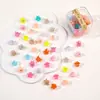 Al por mayor versión coreana de color caramelo dibujos animados clip flor pequeña estrella de cinco puntas pasador de princesa pinza de garra pasador femenino joya en caja