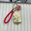 Nuevo Modelo Oro Puro 999 Oro Atrae Fortuna Flor Dinero Llavero Cordón de Cuero Cadena para Teléfono Colgante Decoración de Bolso Regalo