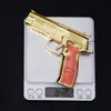 Juguete de pollo para comer M226 banda de goma dorada juguete aleación M226 pistola puede explotar Modelo 10cm