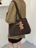 Bolso grande estilo universitario para mujer 2025 nueva moda versátil de un solo hombro simple para clase y desplazamientos bolso tote