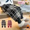 Pantalones de cuadros para niña con forro polar 2026 Nuevo estilo Moda infantil Elegantes para niña Pantalones casuales engrosados Estilo Otoño/Invierno