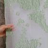 Organza translúcida de luz verde Hilo cortado Textura de relieve estéreo Tejido jacquard Tela para diseñador de ropa