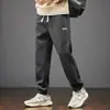 Pantalones Deportivos Sueltos de Invierno Nuevos Transfronterizos para Hombres y Niños Otoño e Invierno Terciopelo Ropa de Trabajo Pantalones Casuales