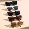 Nuevas gafas de sol de ojo de gato europeas y americanas de forma cóncava populares transfronterizas, gafas de sol de moda con patas recortadas y marco cuadrado grande.