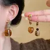 Pendientes Maillard Marrones Otoño e Invierno 2025 para Mujer Estilo Hong Kong Moda Retro Temperamento Pendientes de Piedra Ojo de Tigre Accesorios para Orejas