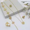 Conjunto de Cuatro Piezas de Pulsera, Collar, Pendientes y Anillo de Trébol de Cuatro Hojas Doble Cara Transfronterizo Incrustado con Diamantes, Joyería Ligera de Diseño de Nicho en Oro de 18 Quilates