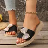 Transfronterizo europeo y americano 2026 nuevo verano lino moda mujer suela suave lazo antideslizante zapatillas de casa venta al por mayor
