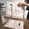 Sacola de loja de roupas Sacola plástica Bolsa pequena Bolsa de compras de joias Sacola de embalagem de presente Cosméticos Sacola de quatro dedos espessada