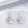 Pendientes de estilo coreano con forma de rosa y gancho para la oreja, con forma de corazón para niña, con circonitas y pétalos de flores elegantes y súper inmortales.