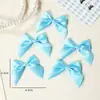 Acessórios de cabelo de laço de cetim 6,5*6,5cm transfronteiriços, materiais de artesanato DIY, acessórios de brinquedo, laços para atacado