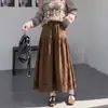 Nueva falda larga plisada hueca de gamuza estilo americano vintage de otoño e invierno, falda midi negra Maillard