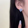 Aretes de Flor de Cuatro Hojas Azul Fresco, Exquisitos, Aretes Simples y Compactos 2025 Nuevos Aretes de Diseño Nicho de Lujo Accesible